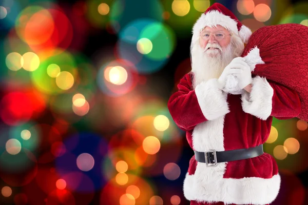 Santa prowadzi jego czerwony worek i uśmiechy — Zdjęcie stockowe