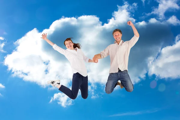 Couple jumping and holding hands — Stock Photo, Image