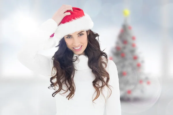 Confused brunette in santa hat — Stock Photo, Image