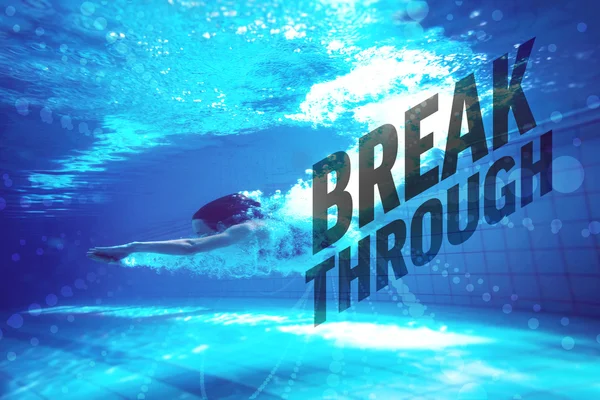 Athletic swimmer smiling at camera underwater — Stock Photo, Image