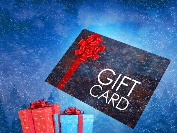 Tarjeta de regalo voladora y regalos — Foto de Stock