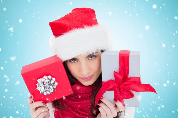 Cheerful brunette holding christmas gifts — Stock Photo, Image