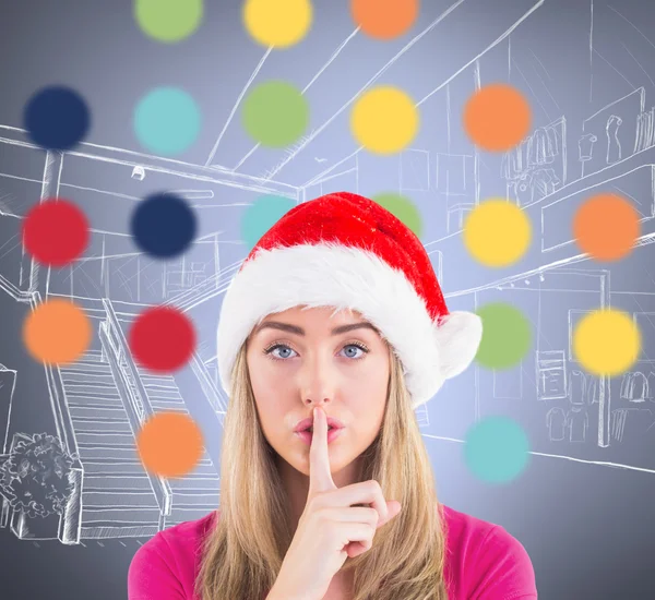 Festive blonde making quiet sign — Stock Photo, Image