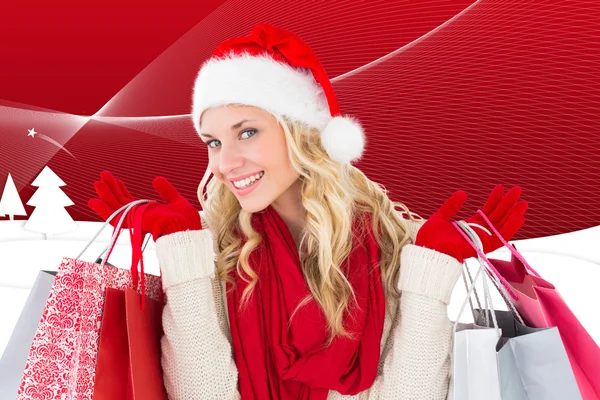 Festive blonde with shopping bags — Stock Photo, Image