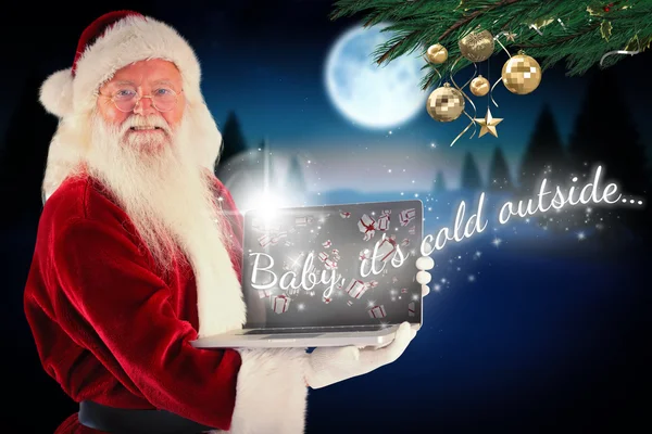 Père Noël présente ordinateur portable — Photo