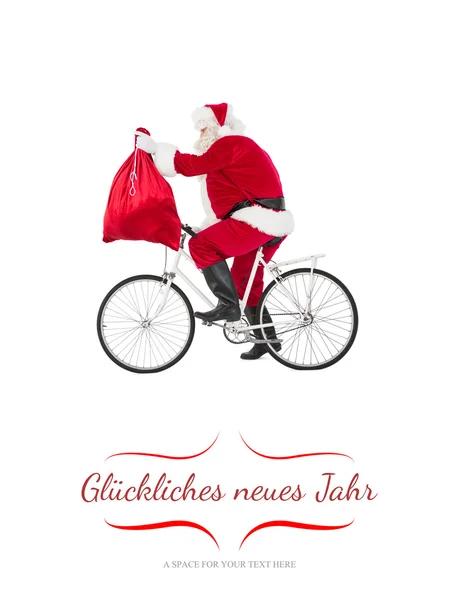 Immagine composita di Babbo Natale in bicicletta e tenendo il sacco — Foto Stock