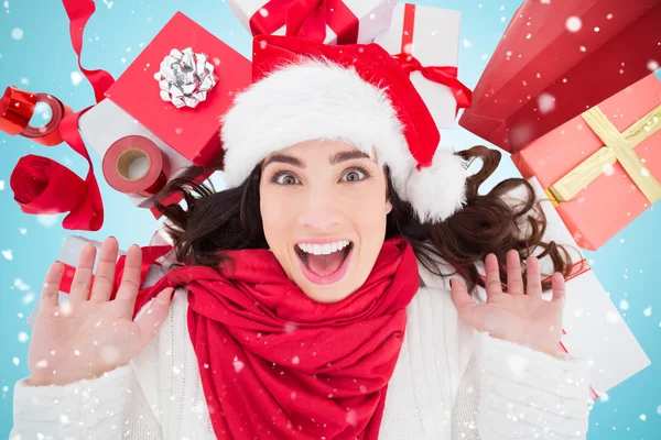 Brunette lying near christmas presents — Stock Photo, Image