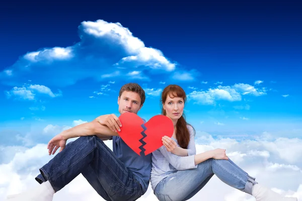 Couple holding a broken heart Stock Image