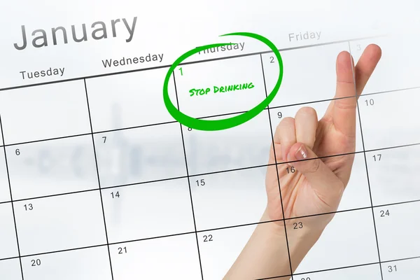 Resolución de año nuevo contra calendario — Foto de Stock