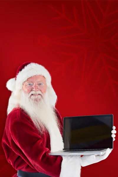 Άγιος Βασίλης παρουσιάζει ένα φορητό υπολογιστή — Φωτογραφία Αρχείου