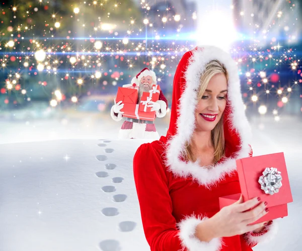 Festive blonde opening gift — Stock Photo, Image