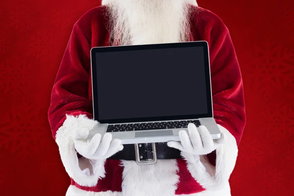 Santa Claus prezentuje laptopa — Zdjęcie stockowe