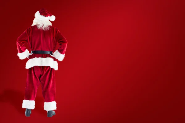 Santa Claus przeciwko czerwony — Zdjęcie stockowe