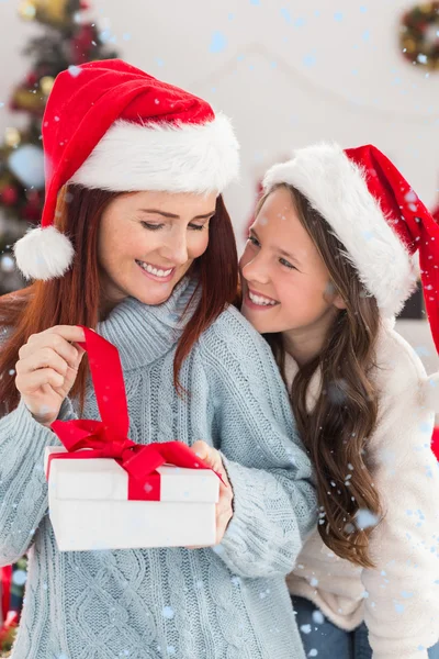 Festive mother and daughter on couch — Stock Photo, Image