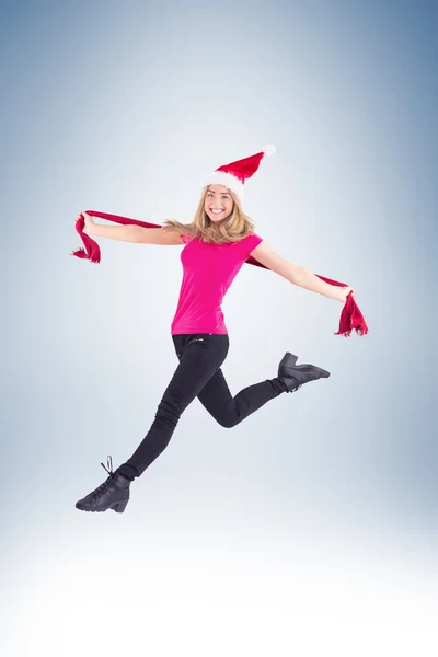 Blonde skipping and smiling at camera — Stock Photo, Image