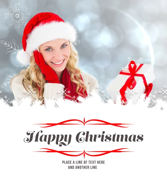 Happy festive blonde with gift — Stock Photo, Image