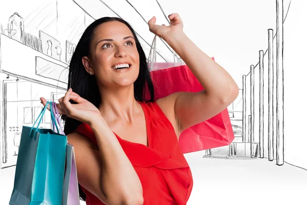 Woman standing with shopping bags — Stock Photo, Image