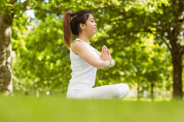 Woman sitting with joined hands — Stock Photo, Image