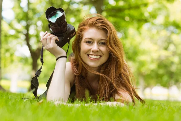 Beautiful female photographer at park — Stock Photo, Image