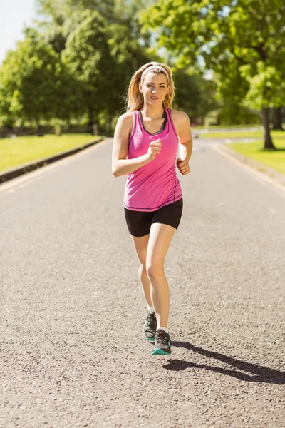 Fit blonde jogging in the park — Stock Photo, Image
