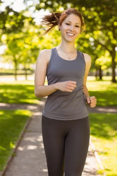 Pretty redhead running — Stock Photo, Image