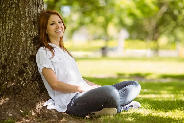 Pretty redhead sitting in casual clothing — Stock Photo, Image