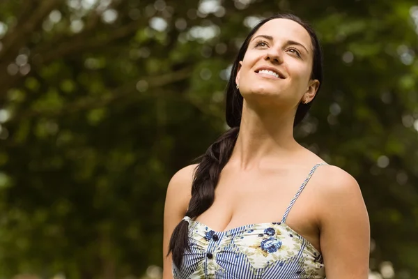 Portrait of a brunette enjoying the sunshine — Stock Photo, Image