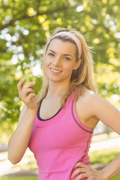 Fit blonde holding green apple — Stock Photo, Image