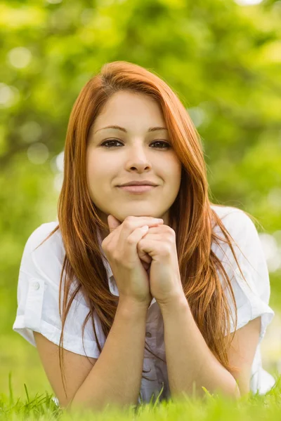 Pretty redhead thoughtful and lying — Stock Photo, Image