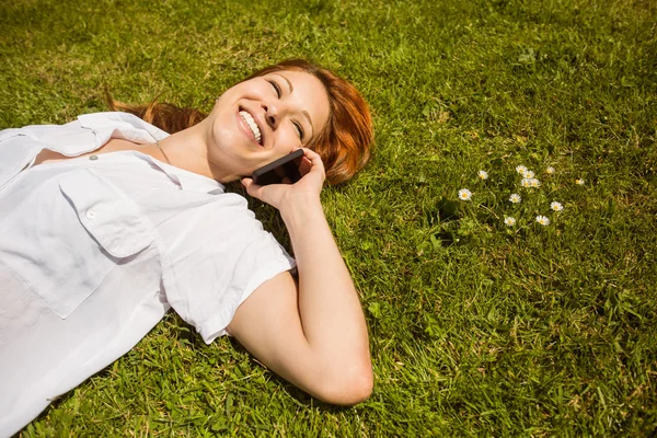 Pretty redhead calling and lying — Stock Photo, Image