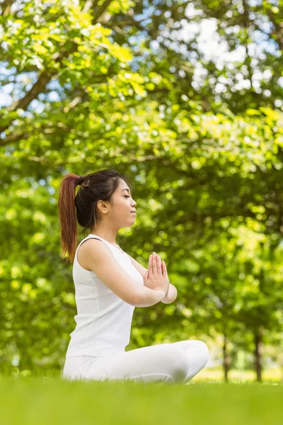 Woman sitting with joined hands — Stock Photo, Image