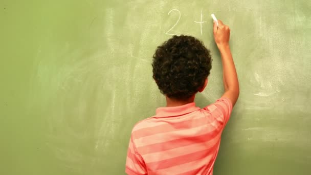 Pupil writing maths on chalkboard — Stock Video