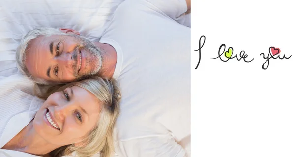 High angle portrait of a mature couple lying — Stock Photo, Image