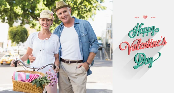 Happy mature couple going for a bike ride — Stock Photo, Image