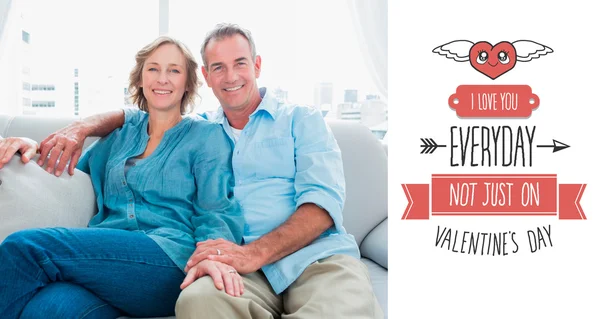 Middle aged couple relaxing on the couch — Stock Photo, Image