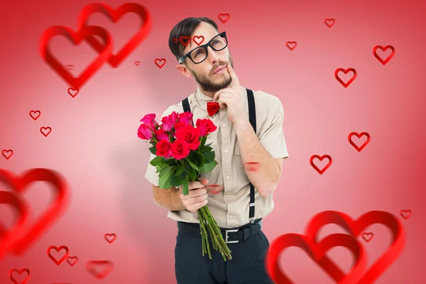 Geeky hipster offering bunch of roses — Stock Photo, Image