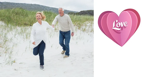 Alegre pareja de ancianos corriendo en la playa —  Fotos de Stock