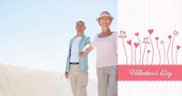 Happy senior couple walking on the pier — Stock Photo, Image