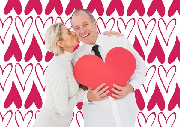 Older couple holding heart shape — Stock Photo, Image