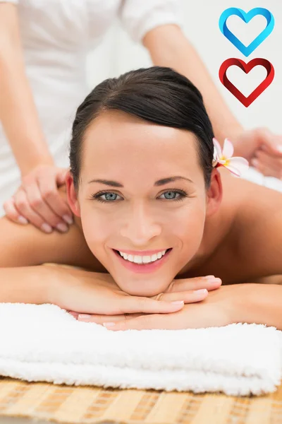 Peaceful brunette enjoying a herbal compress — Stock Photo, Image