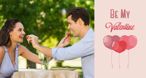 Couple feeding strawberries to each other — Stock Photo, Image