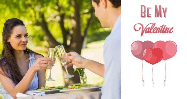 Couple toasting champagne flutes at an outdoor — Stock Photo, Image