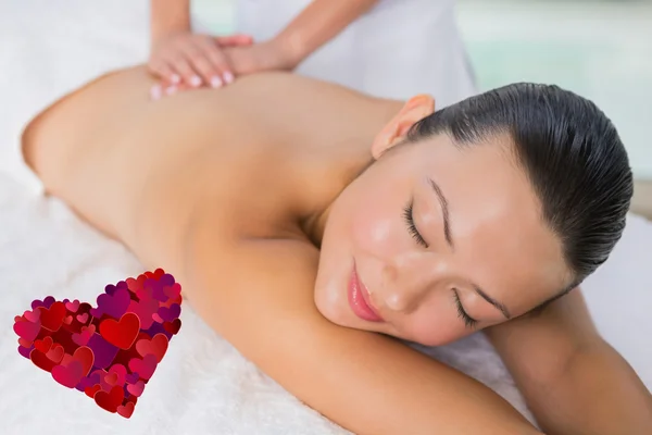 Content brunette enjoying a back massage — Stock Photo, Image