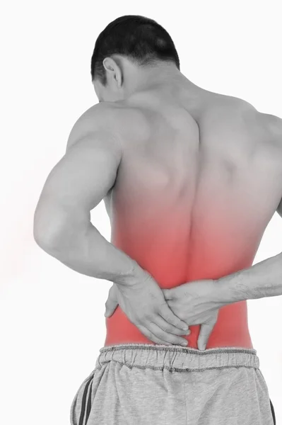 Young male suffering from back pain — Stock Photo, Image