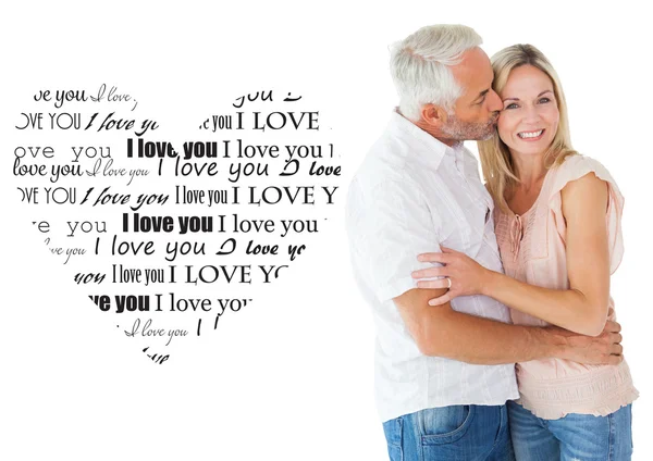 Affectionate man kissing wife on cheek — Stock Photo, Image