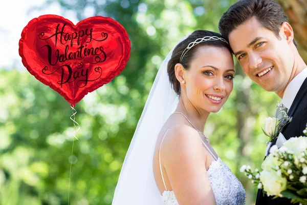 Loving bride and groom in garden — Stock Photo, Image