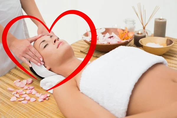 Peaceful brunette enjoying a head massage — Stock Photo, Image