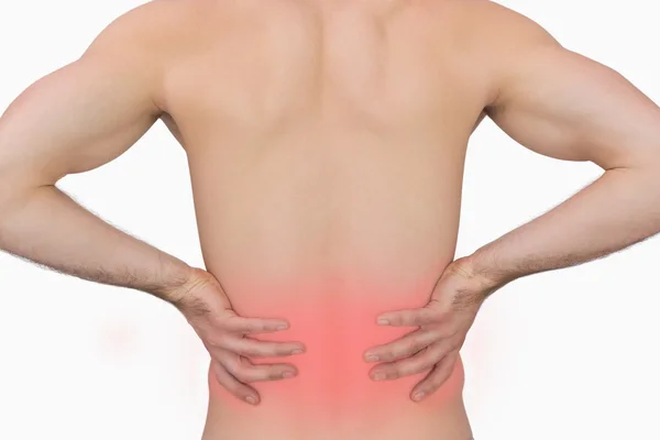 Вид ззаду м'язистого чоловіка з болем у спині — стокове фото