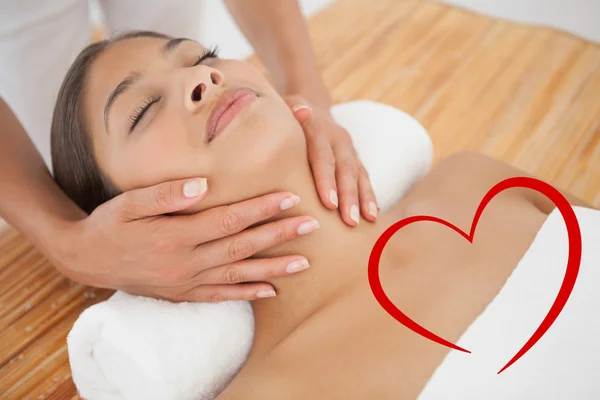 Beautiful brunette enjoying a head massage — Stock Photo, Image