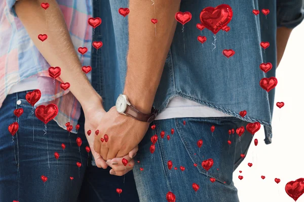 Kompositbild eines hippen jungen Paares, das sich an den Händen hält — Stockfoto